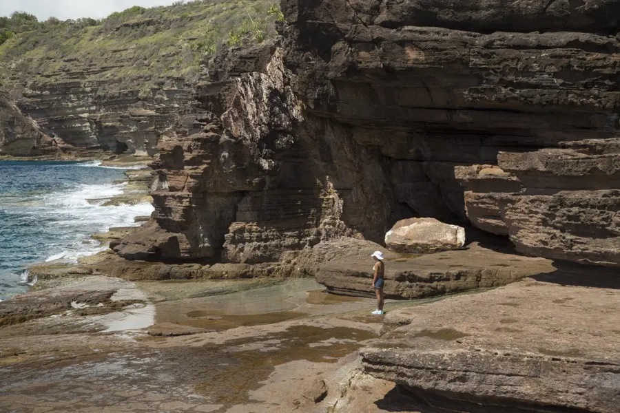 Layered sandstone cliffs and caves