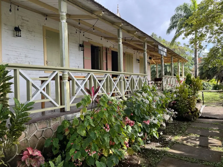 The Pitons rising above a garden fence, St. Lucia