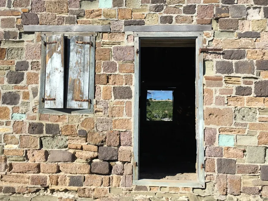 Looking through a ruined stone window to the sea