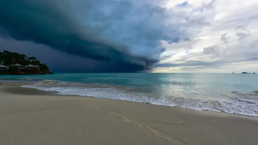Storm clouds rolling in over a beach